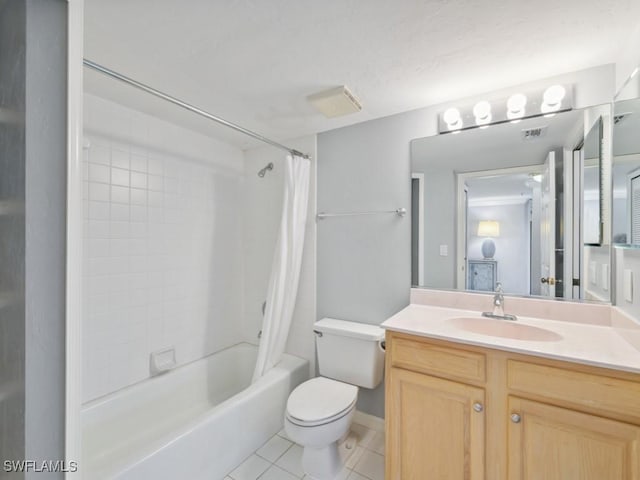 full bathroom with shower / tub combo with curtain, vanity, tile patterned floors, and toilet