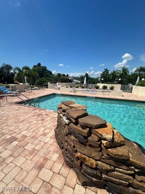 view of swimming pool with a patio area