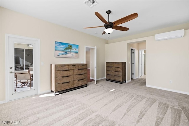 carpeted bedroom featuring ceiling fan and a wall mounted AC