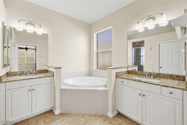 bathroom featuring vanity, tile patterned flooring, and shower with separate bathtub