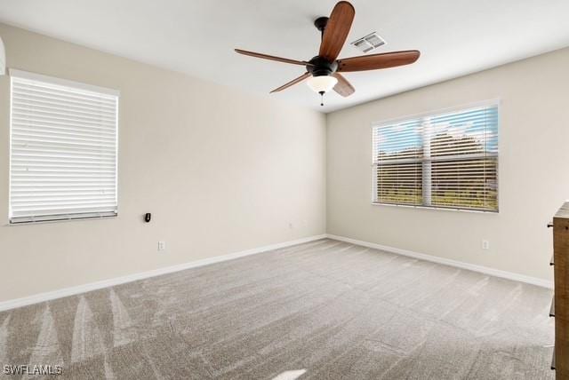 carpeted empty room with ceiling fan