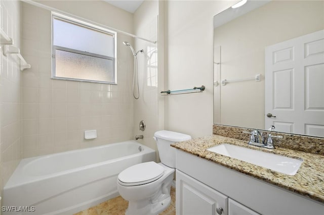 full bathroom with tiled shower / bath combo, vanity, and toilet