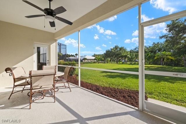 sunroom / solarium with ceiling fan