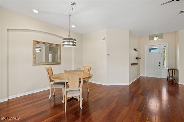 dining area with dark wood-type flooring