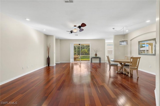 interior space featuring ceiling fan and dark hardwood / wood-style flooring