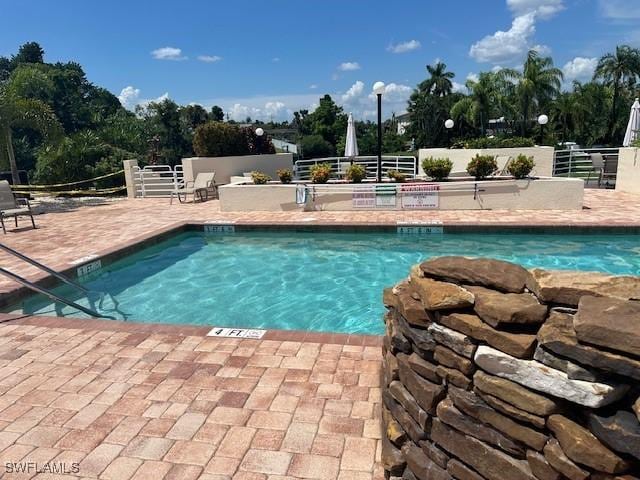 view of swimming pool featuring a patio