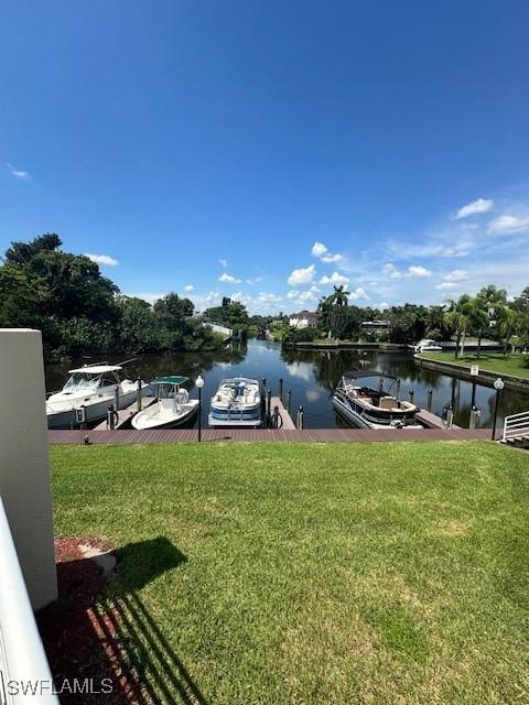 exterior space with a dock and a water view