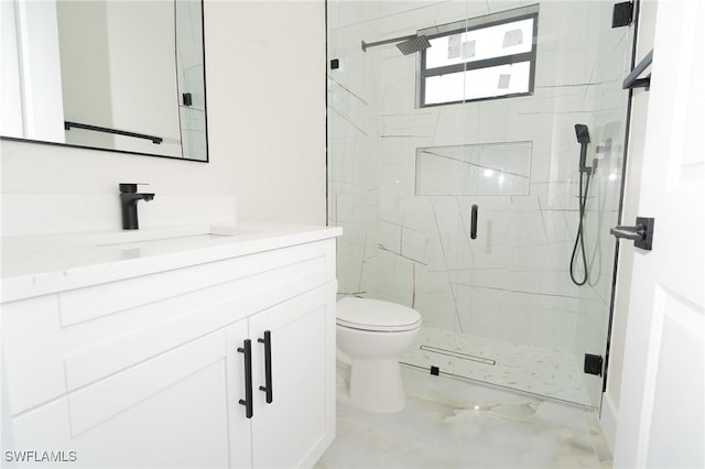 bathroom featuring vanity, toilet, and walk in shower