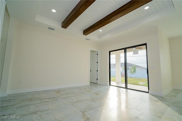 spare room with beam ceiling