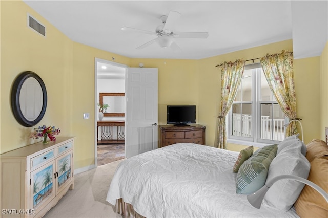 bedroom with light carpet, ceiling fan, and visible vents