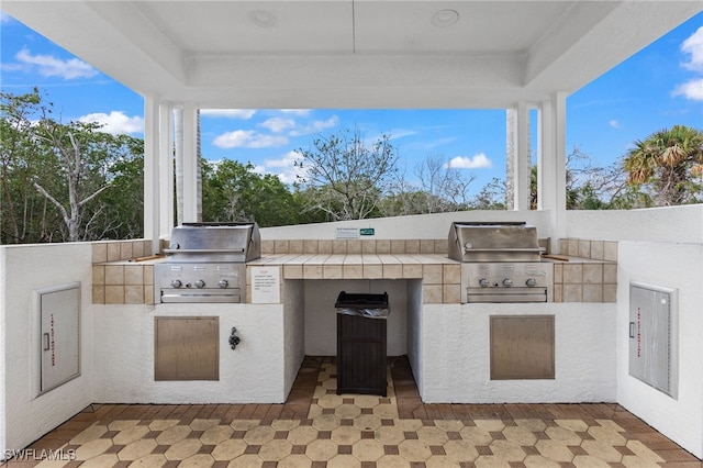 view of patio with a grill and an outdoor kitchen