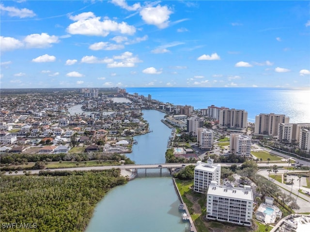 drone / aerial view with a view of city and a water view