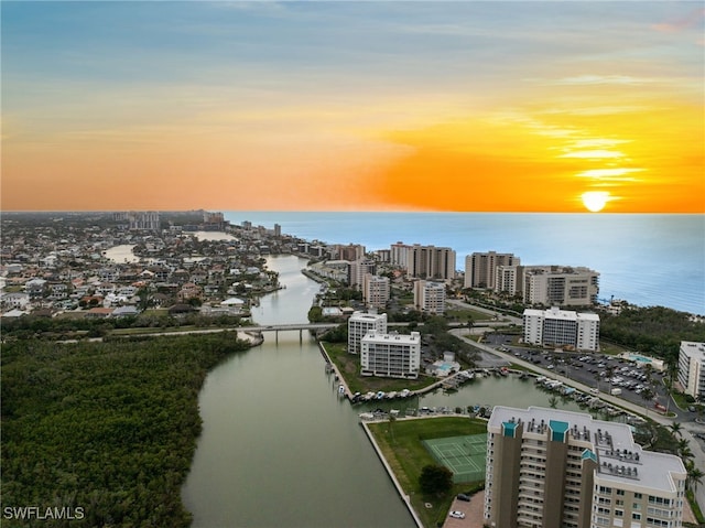 drone / aerial view featuring a water view and a city view