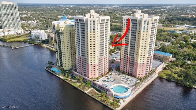 birds eye view of property with a water view