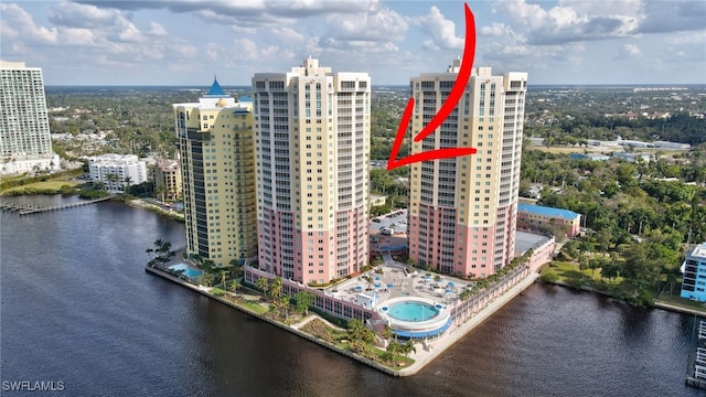 birds eye view of property with a water view