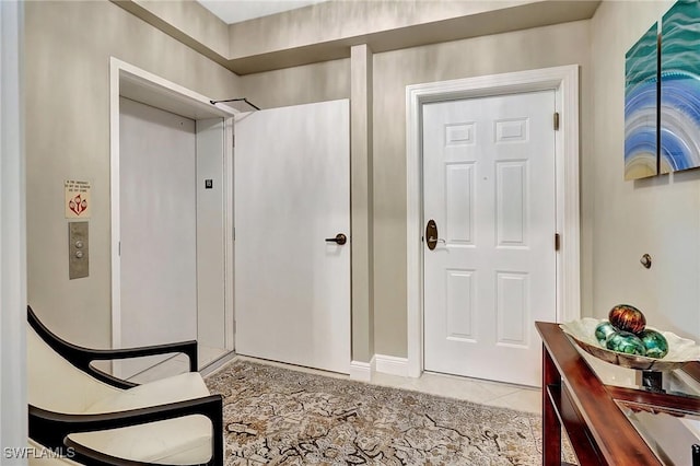 entryway featuring light tile patterned flooring