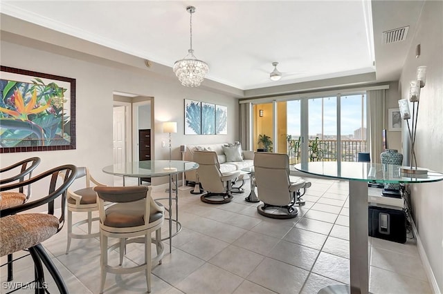 living room featuring light tile patterned floors, crown molding, and ceiling fan with notable chandelier