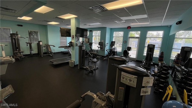 workout area featuring a paneled ceiling