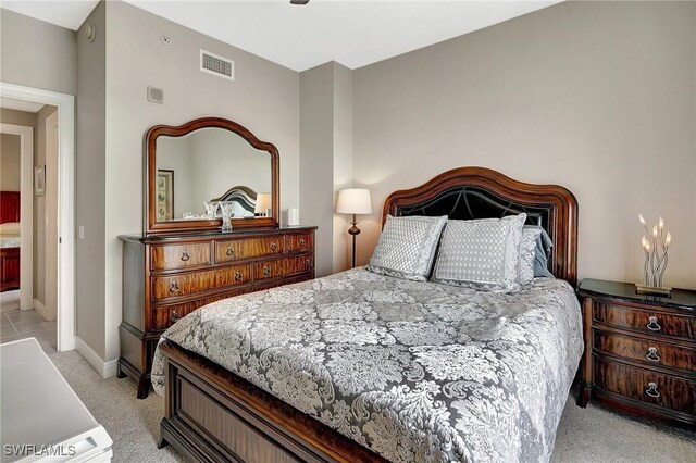 bedroom featuring light colored carpet