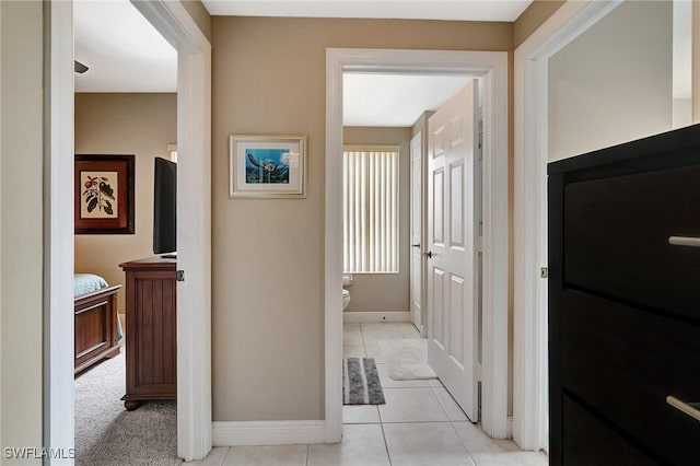 hallway featuring light tile patterned floors