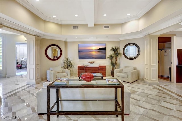 living room with ornate columns and crown molding