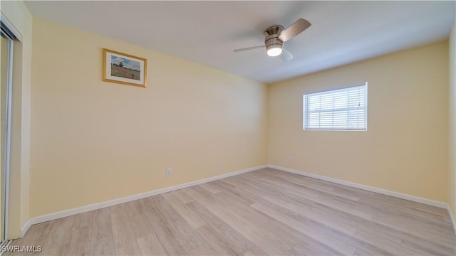 empty room featuring ceiling fan and light wood-type flooring