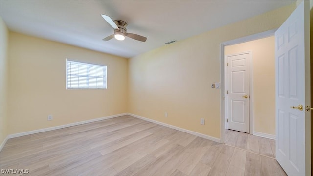 unfurnished room featuring ceiling fan and light hardwood / wood-style floors