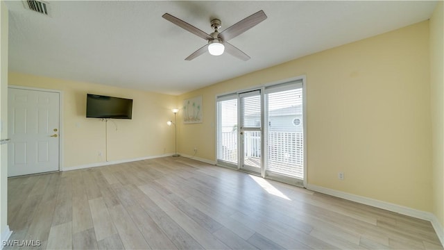 spare room with ceiling fan and light hardwood / wood-style floors