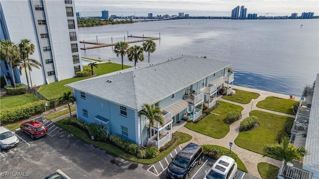 birds eye view of property with a water view