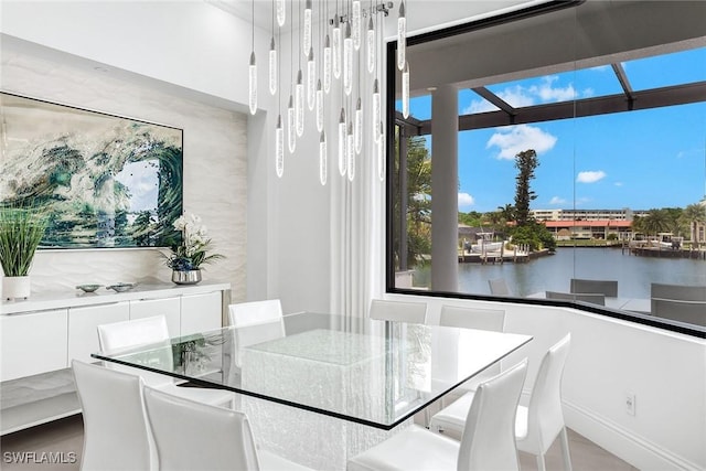 dining room featuring a water view