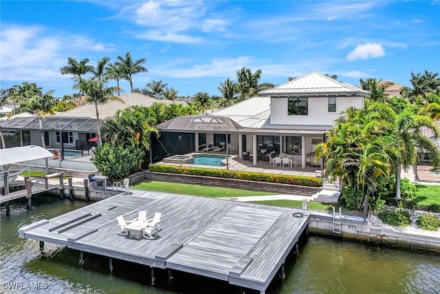 dock area featuring glass enclosure, a patio, and a water view