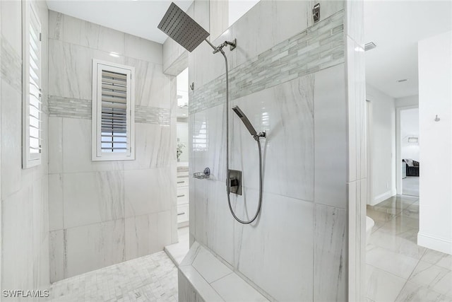 bathroom featuring tiled shower