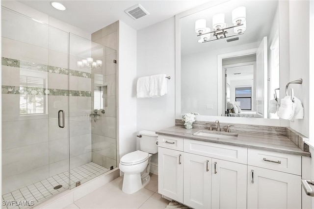 bathroom with toilet, tile patterned flooring, an enclosed shower, and vanity