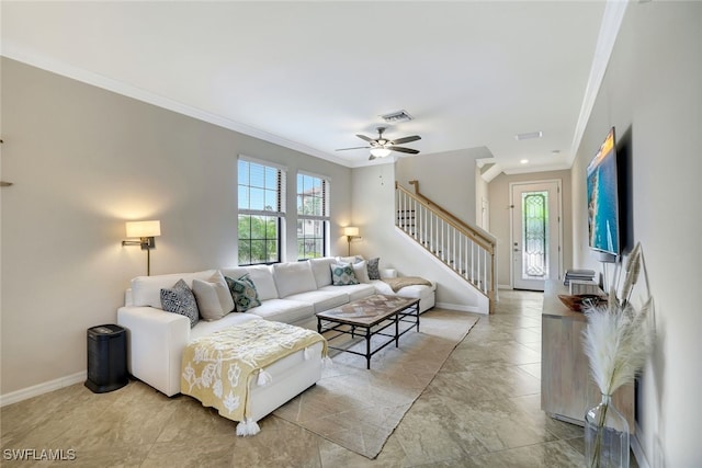 living room with ceiling fan and crown molding