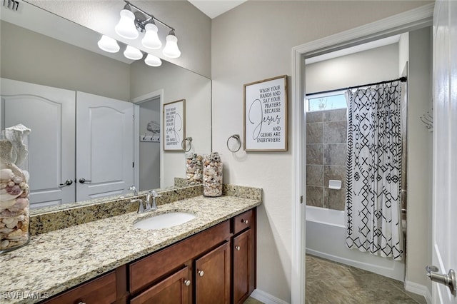 bathroom featuring shower / bath combo with shower curtain and vanity