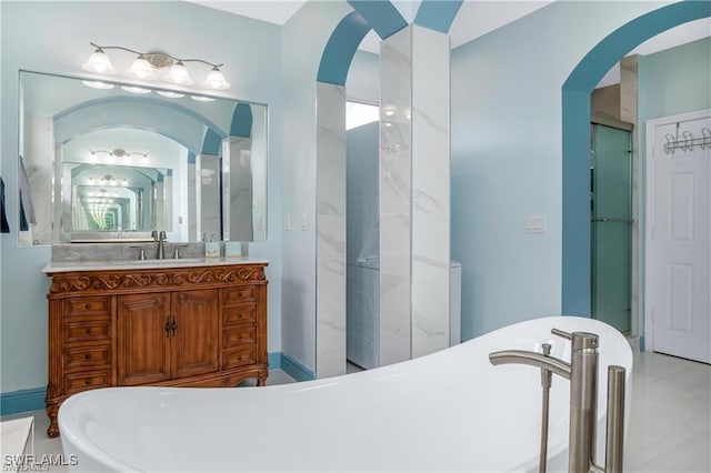 bathroom featuring vanity and separate shower and tub