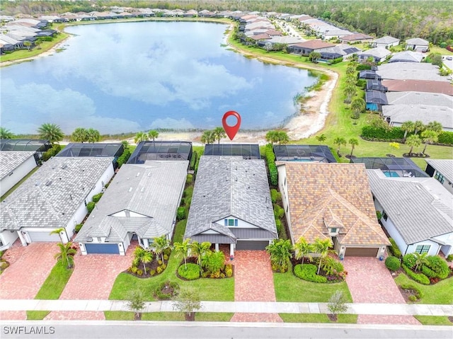 birds eye view of property with a water view