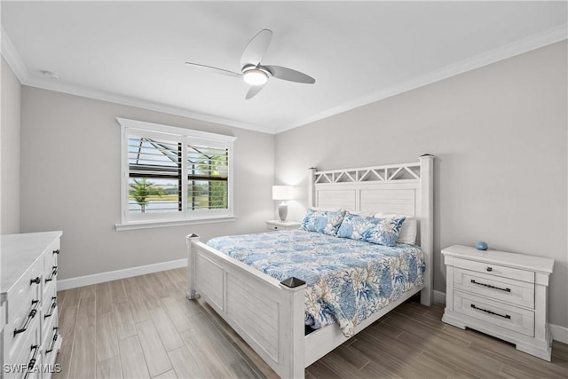 bedroom with ceiling fan, ornamental molding, and hardwood / wood-style floors