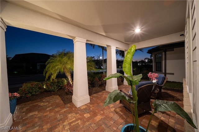 view of patio terrace at dusk