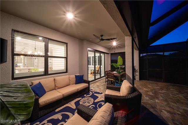 view of patio with a lanai, outdoor lounge area, and ceiling fan