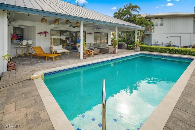 view of pool featuring ceiling fan, an outdoor hangout area, and a patio area