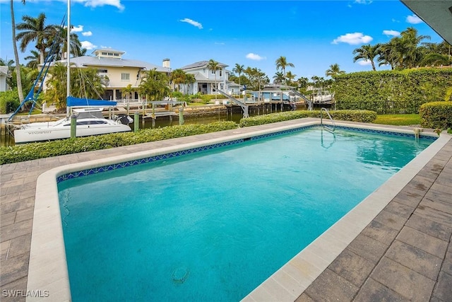 view of pool featuring a water view