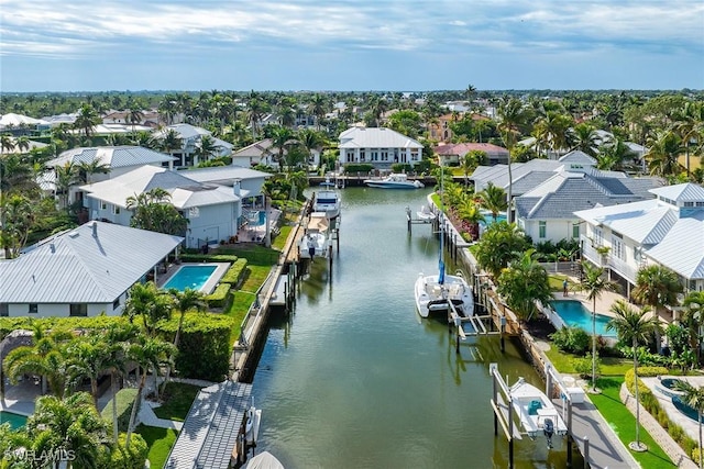 birds eye view of property featuring a water view