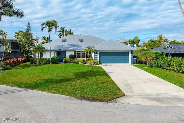 view of front of house featuring a garage and a front yard