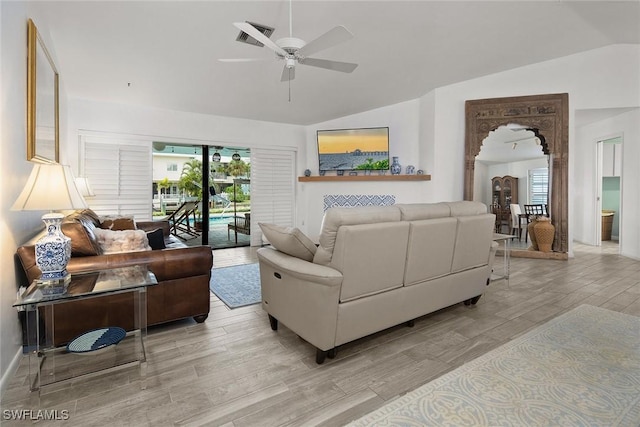 living room with lofted ceiling and ceiling fan