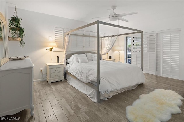 bedroom with ceiling fan and light hardwood / wood-style floors