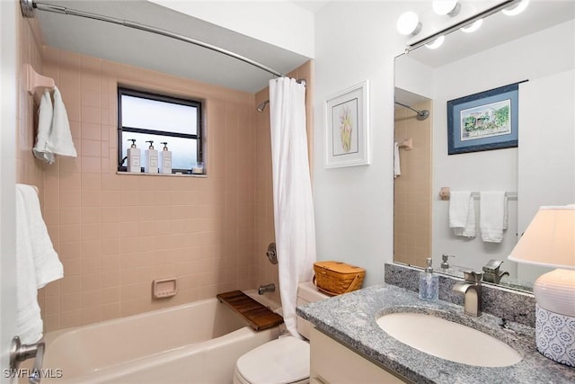 full bathroom featuring vanity, shower / bath combo, and toilet