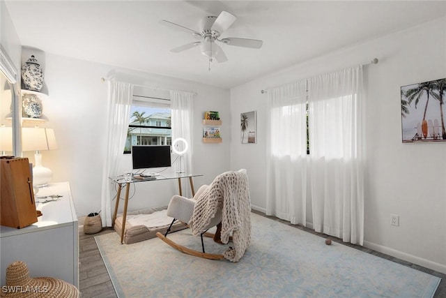 interior space with ceiling fan