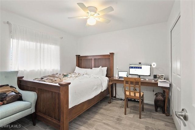 bedroom with ceiling fan and a closet