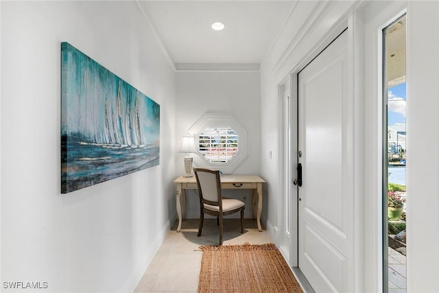 hall featuring plenty of natural light, ornamental molding, and a water view